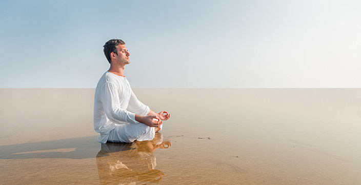 man meditating in nature