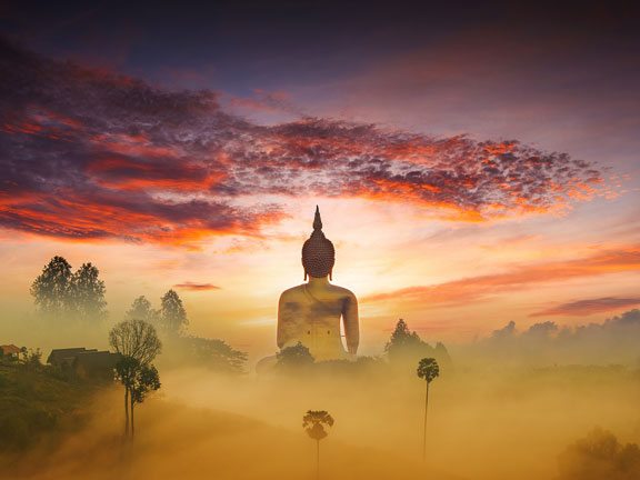 статуя будды на рассвете