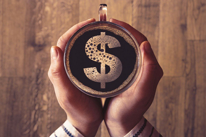 знак доллара в чашке кофе фото