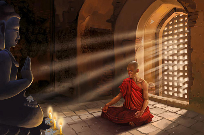 буддийский монах медитирует у статуи будды